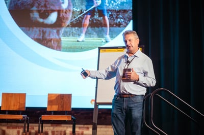 Coach Rob Speaking at an Event